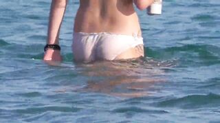 Beach girl goes for swimming in panties - watch out