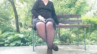 Naughty milf in pantyhose pissing in the park on a bench rear view