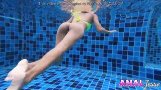 Asian Girl Swims with Big Butt Plug