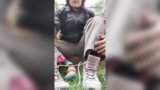 Biker chick takes off her dirty sneakers and socks after a long journey. Tik Tok