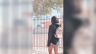 college girl shows her breasts and buttocks in a public area and they catch her