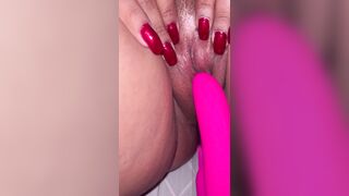 Red nails holding pussy with a vibration for orgasm